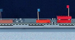 Відштовхування двох машин з однаковою масою за допомогою пружини